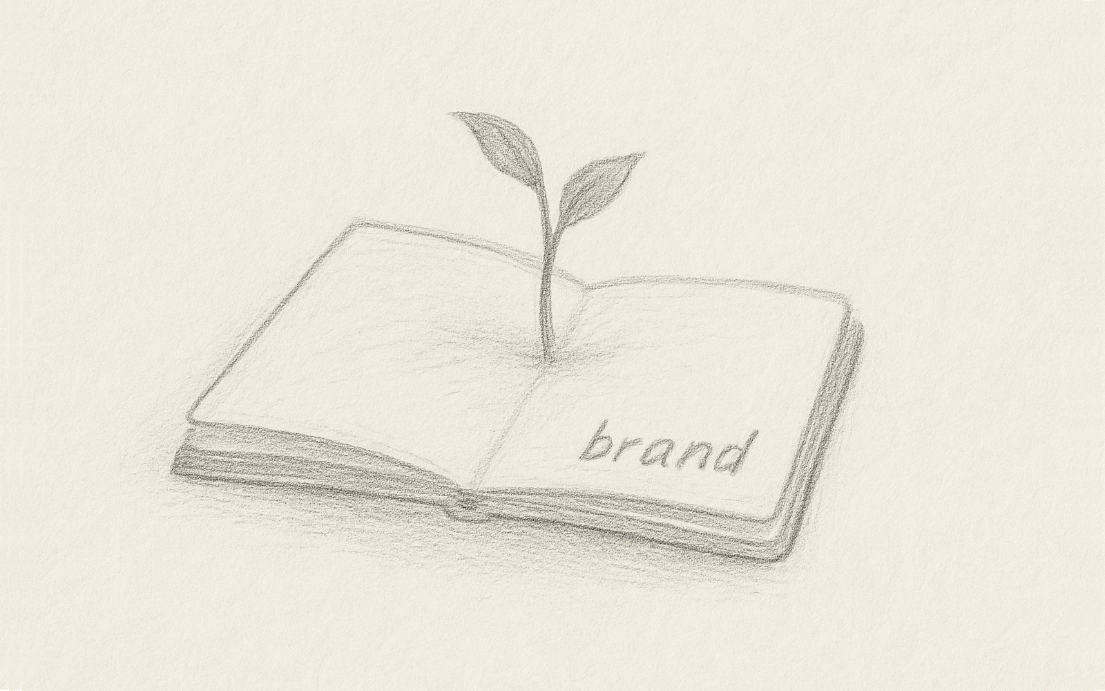 A tiny plant sprouting from an open sketchbook, representing a brand idea taking root.